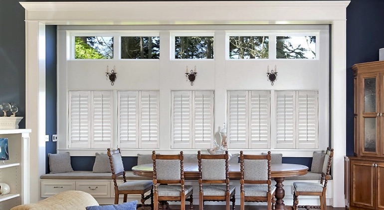 Gainesville dining room with shut plantation shutters.